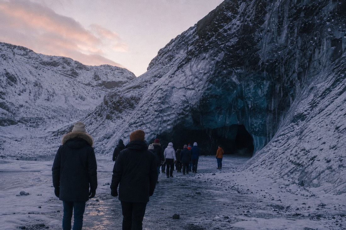 A guided group on the ice during a three-day South Coast winter tour with an ice cave