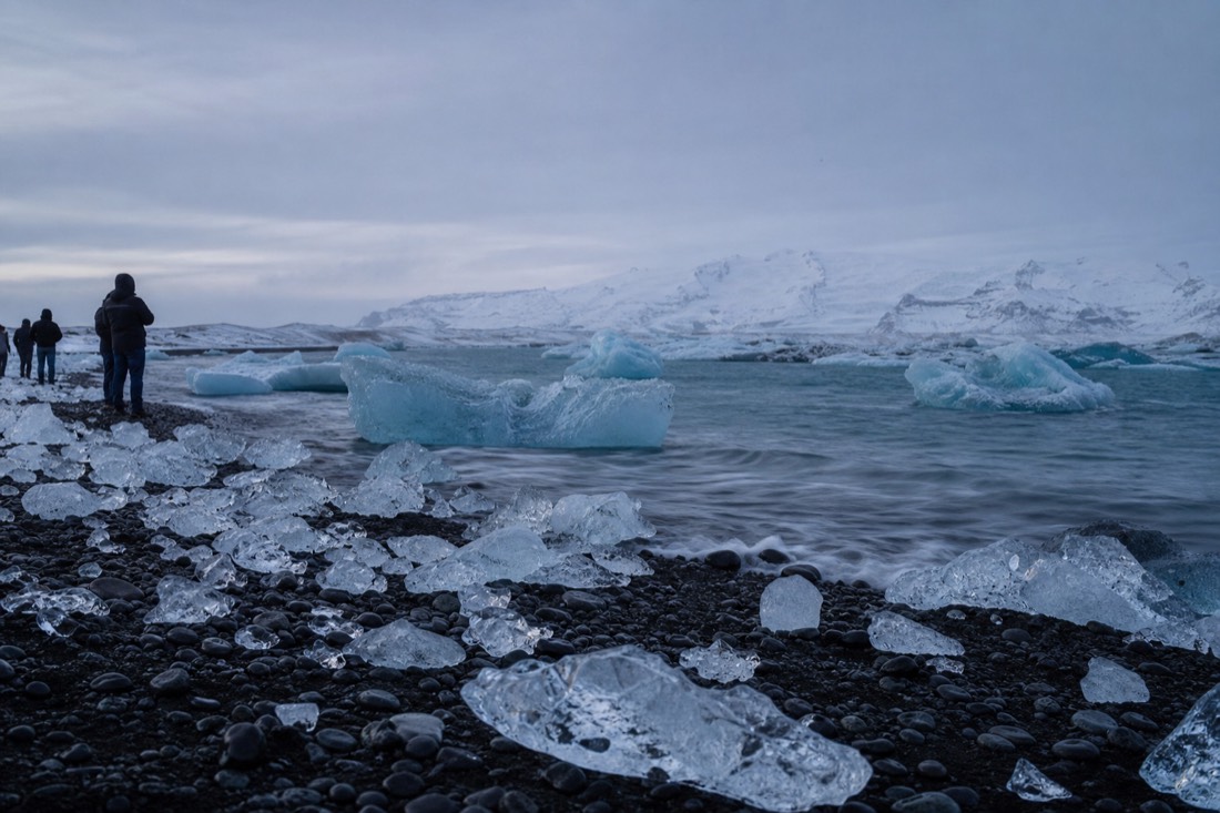 Blue ice and black sand at Jökulsárlón on a three-day Iceland winter tour package